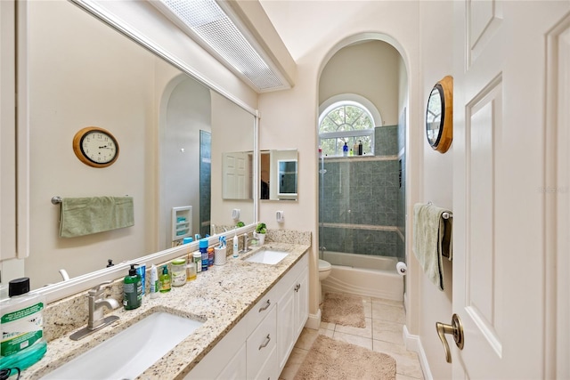 168 Rue Des Chateaux, Tarpon Springs, FL 34688 - bathroom featuring double vanity, tile patterned flooring, and washtub / shower combination