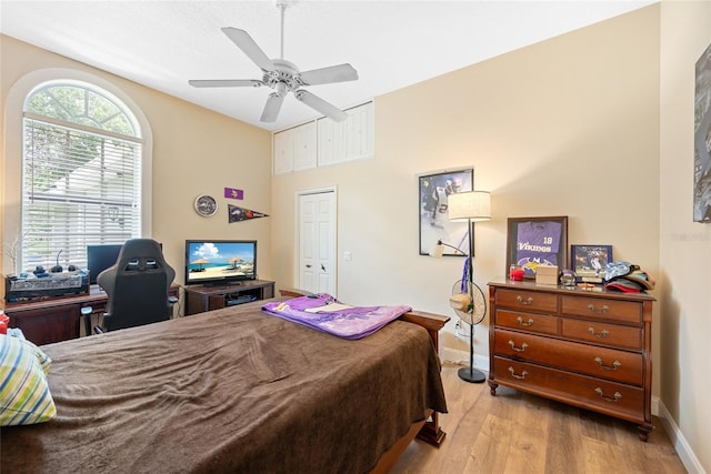 168 Rue Des Chateaux, Tarpon Springs, FL 34688 - bedroom featuring light wood-style flooring, a ceiling fan, and an office area