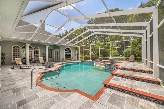 168 Rue Des Chateaux, Tarpon Springs, FL 34688 - view of pool with a patio area, a pool with connected hot tub, and a lanai