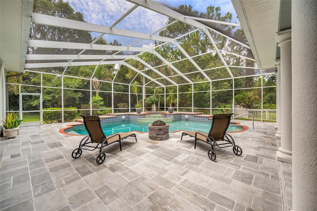 168 Rue Des Chateaux, Tarpon Springs, FL 34688 - view of swimming pool with a pool with connected hot tub, a patio, and a lanai