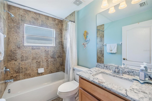 full bathroom with vanity, toilet, and shower / bath combo with shower curtain