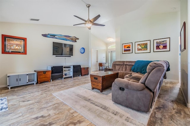 living room featuring ceiling fan and lofted ceiling