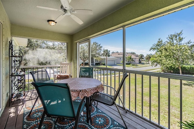 sunroom / solarium with ceiling fan