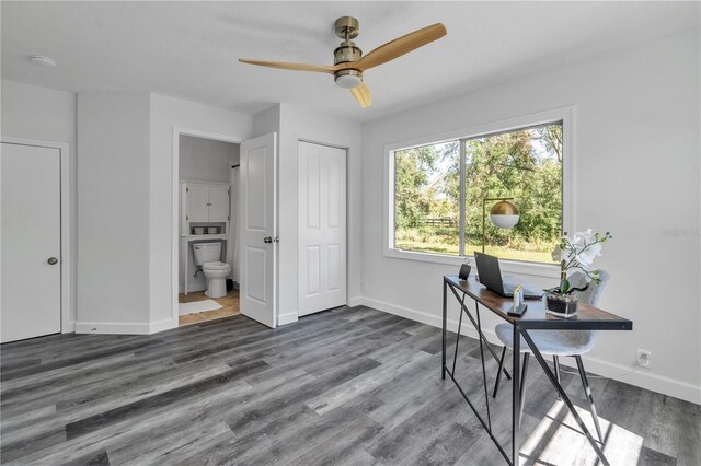 office with ceiling fan and dark hardwood / wood-style floors