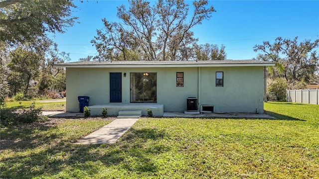 back of house with a yard