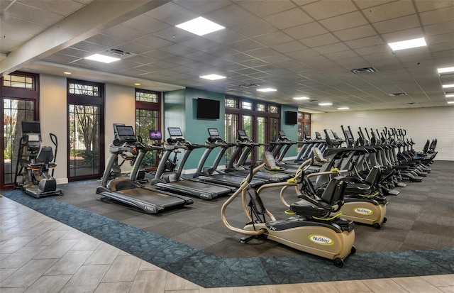 gym featuring a paneled ceiling