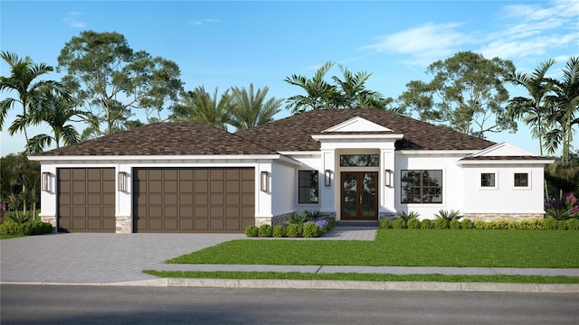 view of front facade with a garage and a front lawn