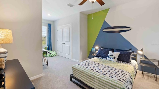 bedroom with light colored carpet and ceiling fan