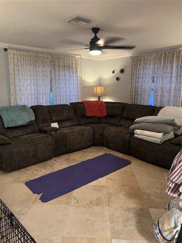 living room featuring crown molding and ceiling fan