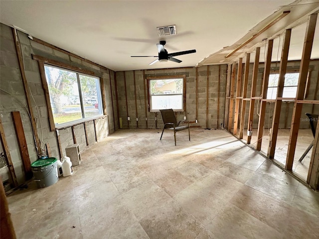 misc room featuring ceiling fan and plenty of natural light