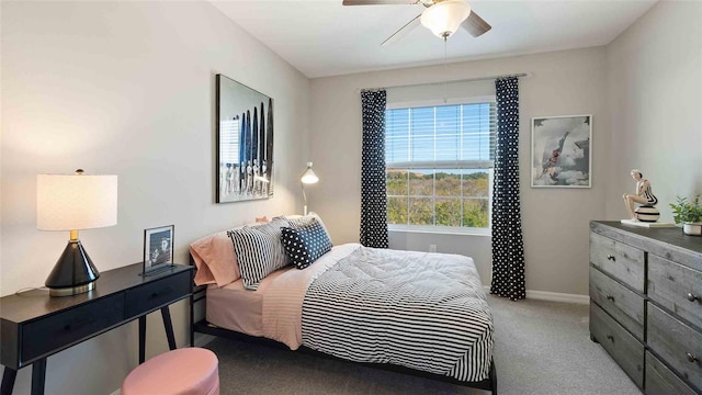 bedroom with light colored carpet and ceiling fan