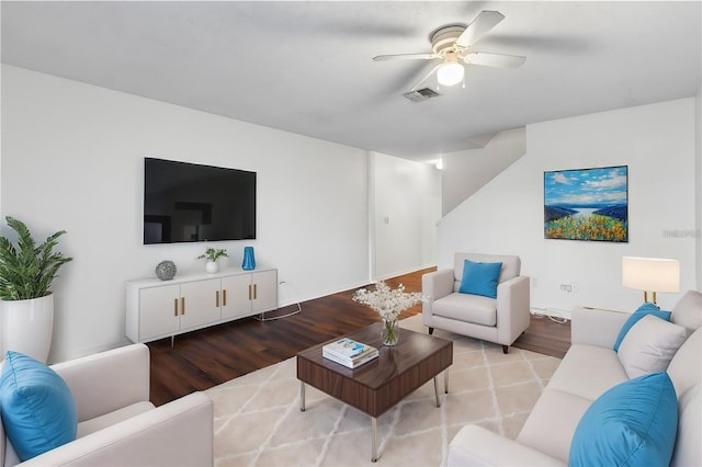 living room with ceiling fan and light wood-type flooring