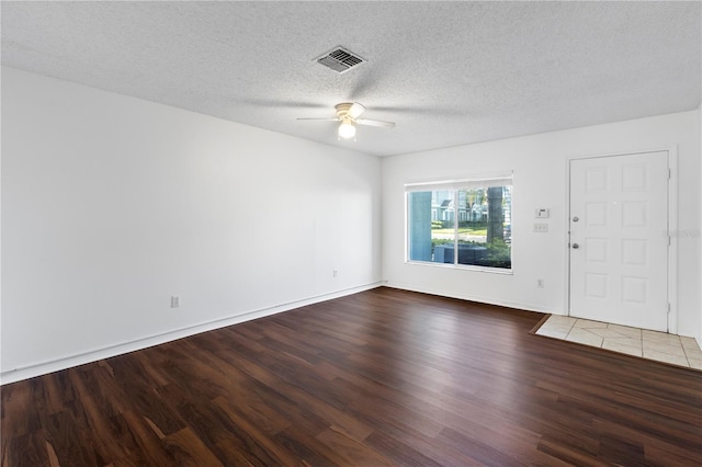 interior space featuring a textured ceiling, wood-type flooring, and ceiling fan