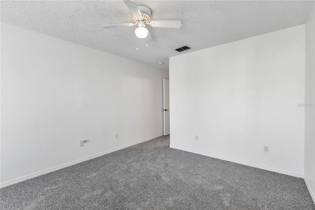 carpeted empty room featuring a textured ceiling and ceiling fan