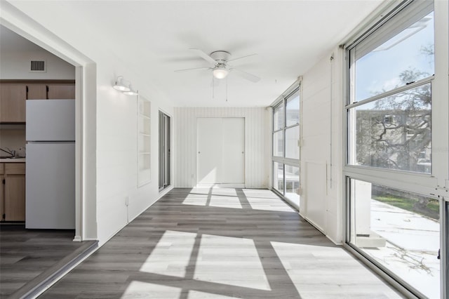 hallway featuring dark wood-type flooring and sink