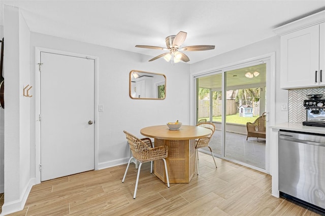 dining space with light wood-style flooring, baseboards, and ceiling fan