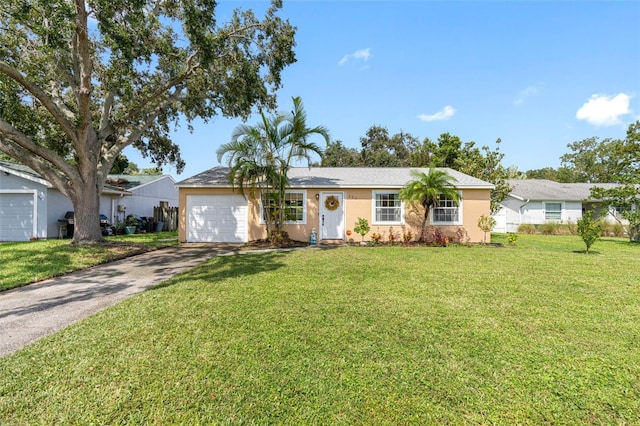 ranch-style house featuring a garage, driveway, a front lawn, and stucco siding