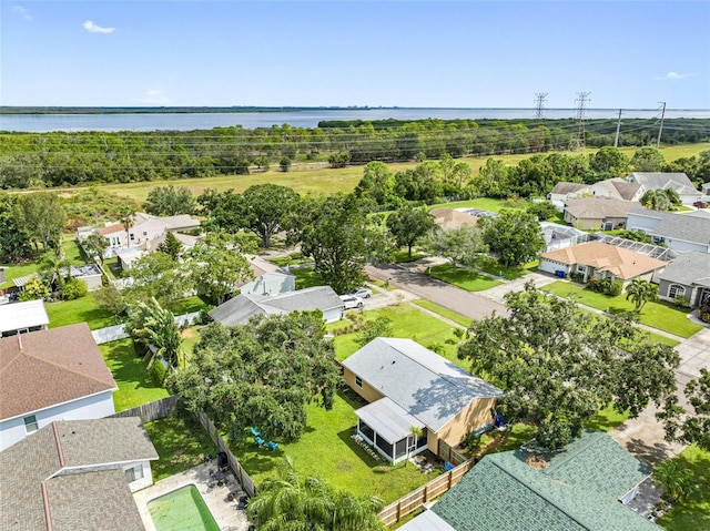 drone / aerial view with a residential view and a water view