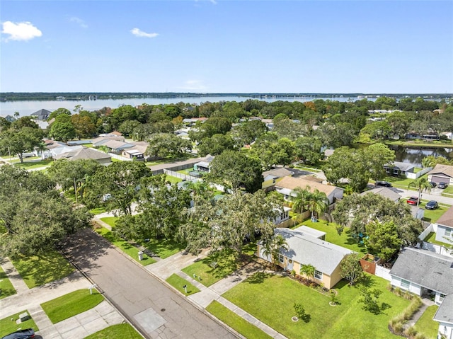 bird's eye view featuring a water view and a residential view