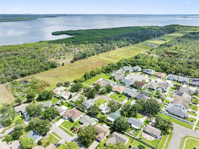 birds eye view of property with a water view and a residential view