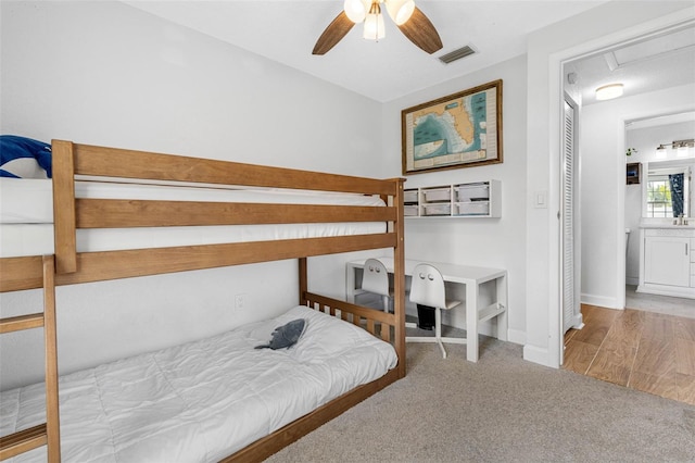 bedroom featuring carpet floors, visible vents, baseboards, and a ceiling fan