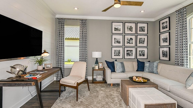 living room featuring hardwood / wood-style flooring, ceiling fan, and crown molding