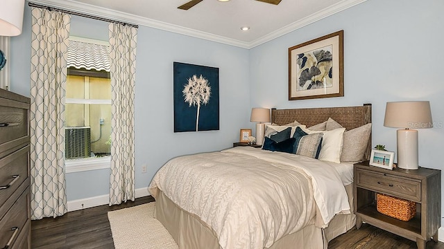 bedroom with dark hardwood / wood-style flooring, ceiling fan, crown molding, and multiple windows