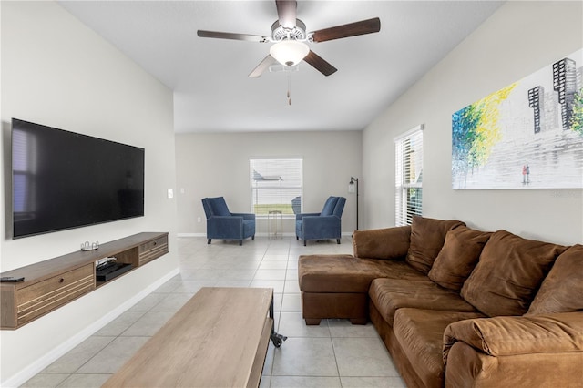 living room featuring light tile patterned flooring and ceiling fan