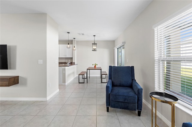 sitting room with light tile patterned flooring