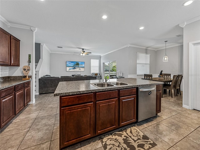 kitchen featuring dishwasher, a center island with sink, sink, crown molding, and pendant lighting