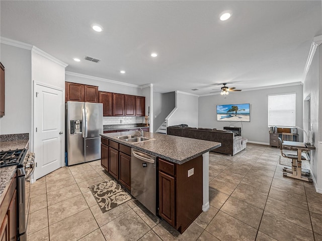 8720 Savory Walk Dr, Land O Lakes, FL 34637 - kitchen with crown molding, appliances with stainless steel finishes, a sink, and visible vents
