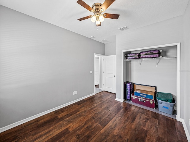 8720 Savory Walk Dr, Land O Lakes, FL 34637 - unfurnished bedroom with ceiling fan, visible vents, wood finished floors, baseboards, and a closet
