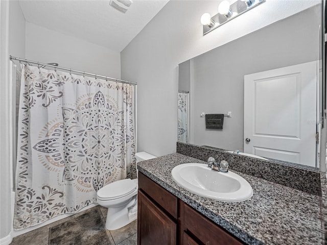 bathroom with vanity, toilet, tile patterned floors, and a shower with curtain