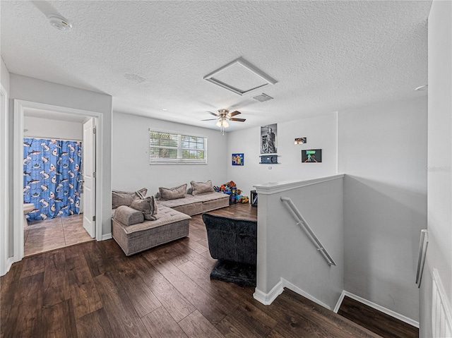 living room featuring hardwood / wood-style floors and a textured ceiling