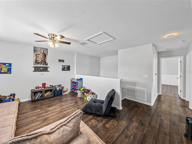 8720 Savory Walk Dr, Land O Lakes, FL 34637 - game room with a textured ceiling, visible vents, attic access, and hardwood / wood-style floors