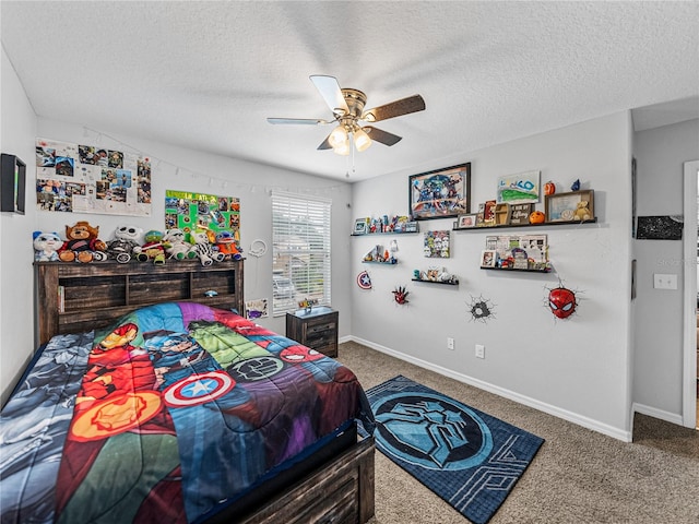 bedroom featuring carpet flooring, a textured ceiling, and ceiling fan