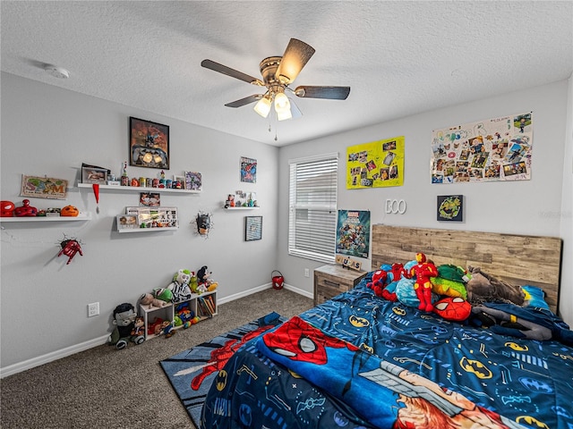 carpeted bedroom with a textured ceiling and ceiling fan