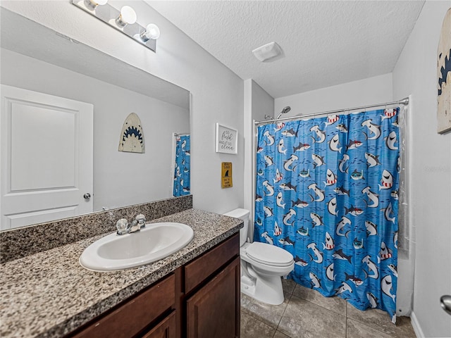 bathroom featuring a textured ceiling, toilet, vanity, curtained shower, and tile patterned flooring