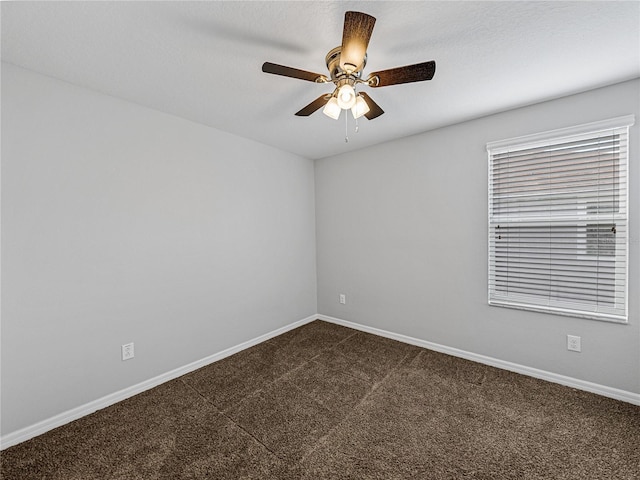 8720 Savory Walk Dr, Land O Lakes, FL 34637 - spare room featuring baseboards, ceiling fan, and dark carpet