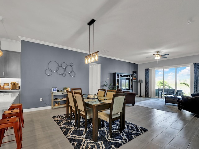 dining space with ornamental molding, light hardwood / wood-style floors, and ceiling fan