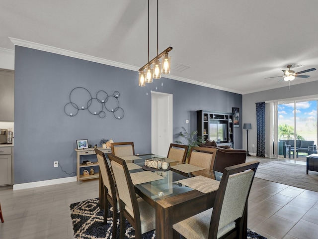 dining area featuring crown molding and ceiling fan