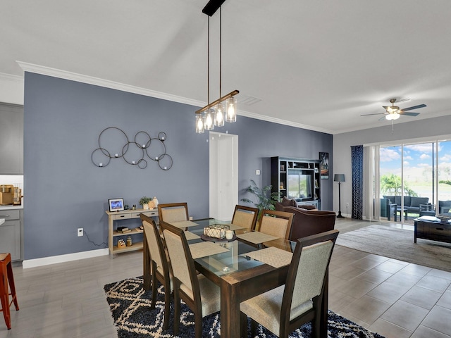 dining space with ornamental molding and ceiling fan with notable chandelier