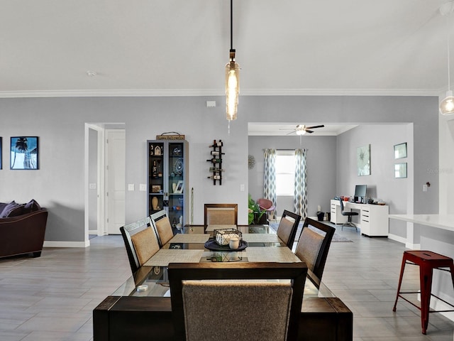 dining space with crown molding, wood-type flooring, and ceiling fan