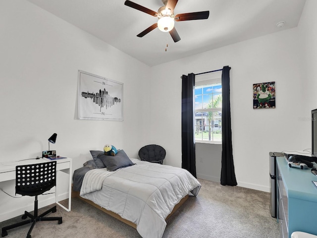 bedroom featuring light carpet and ceiling fan