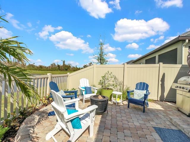 view of patio / terrace with an outdoor fire pit