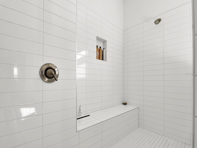 bathroom with tiled shower