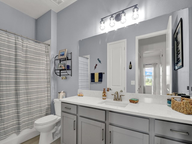 full bathroom with vanity, toilet, and shower / bath combination with curtain