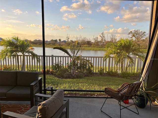 view of patio with a water view and outdoor lounge area