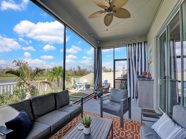 sunroom / solarium with ceiling fan