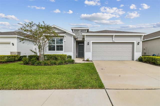 ranch-style home with a front yard and a garage